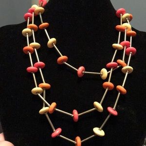 Silver and pink/orange/yellow beaded necklace